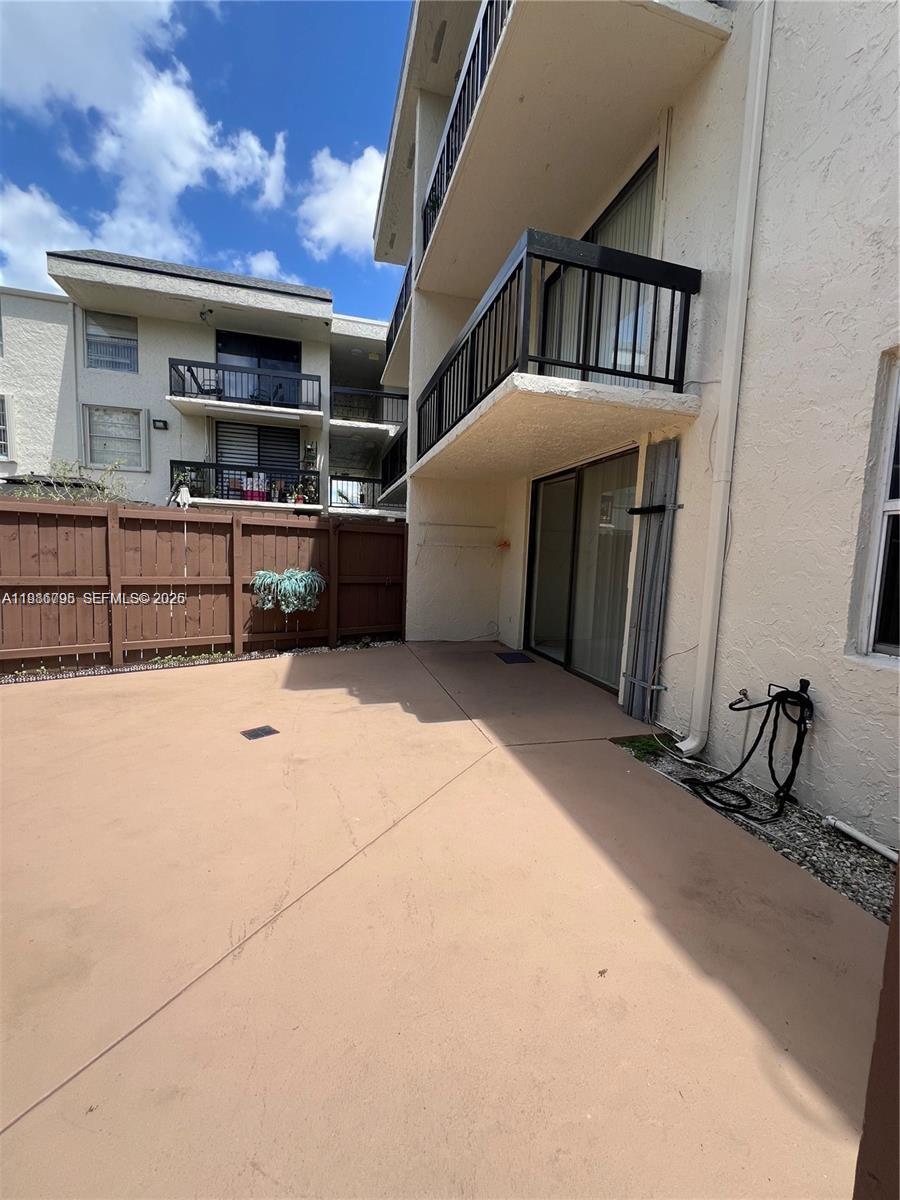 8307 Southwest 142nd Avenue, Unit F105 Miami, FL 33183 - Photo 1 of 19 a view of a garage with furniture