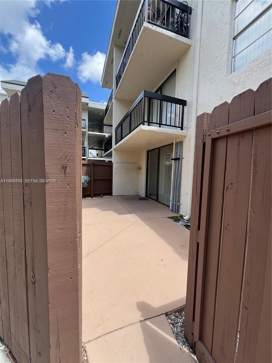 8307 Southwest 142nd Avenue, Unit F105 Miami, FL 33183 - Photo 2 of 19 a view of a house with a garage
