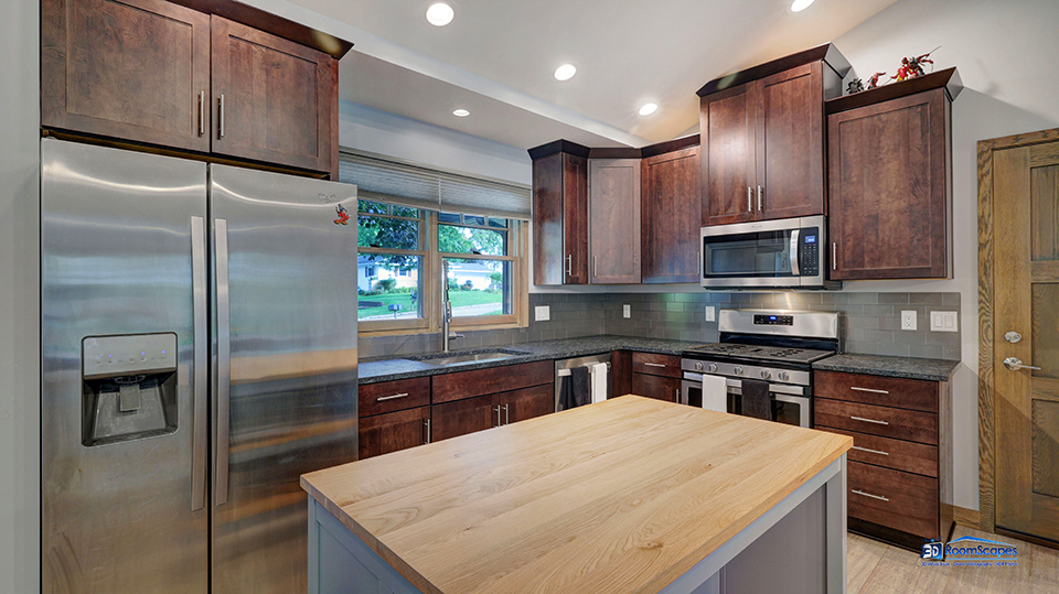 125 Hillcrest Drive Burlington, WI 53105 - Photo 11 of 52 a kitchen with a refrigerator a sink and cabinets