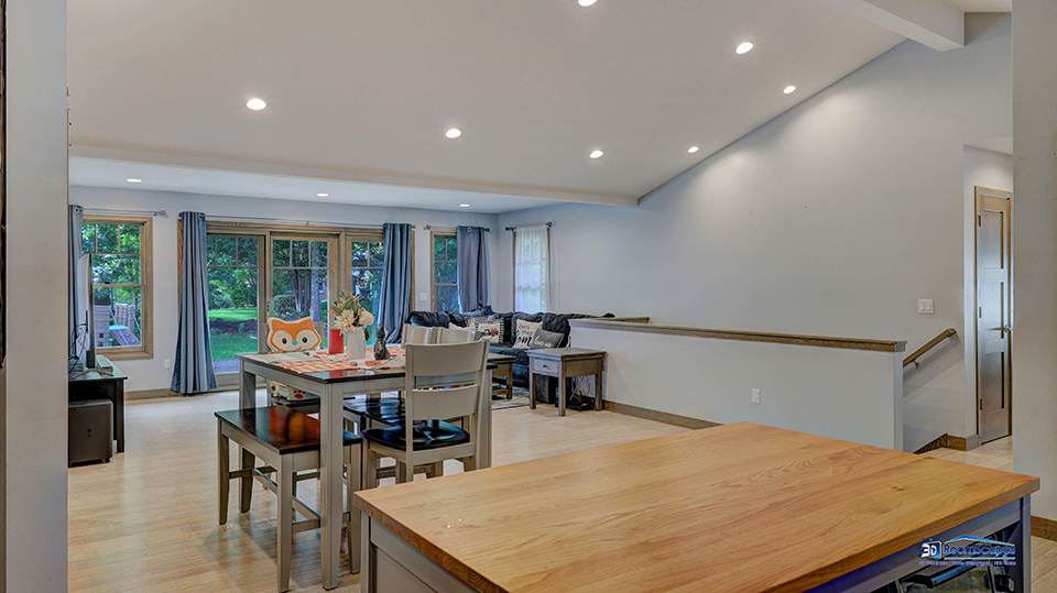 125 Hillcrest Drive Burlington, WI 53105 - Photo 13 of 52 a living room with dining room and wooden floor