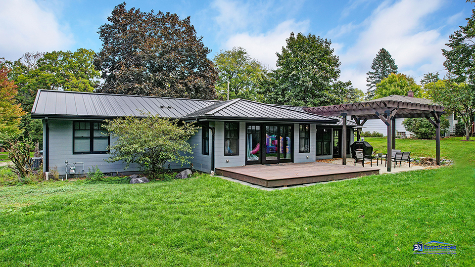 125 Hillcrest Drive Burlington, WI 53105 - Photo 43 of 52 a front view of a house with a yard table and chairs