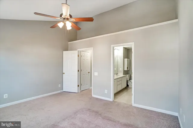 a bathroom with a double vanity sink mirror and toilet