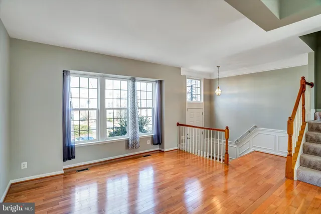 a view of an empty room with glass door