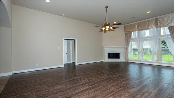a kitchen with stainless steel appliances granite countertop a stove a refrigerator and a sink with wooden cabinets