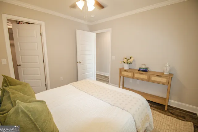 a bedroom with a bed and a desk