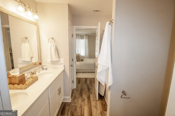 a en suite bathroom with a sink and a mirror