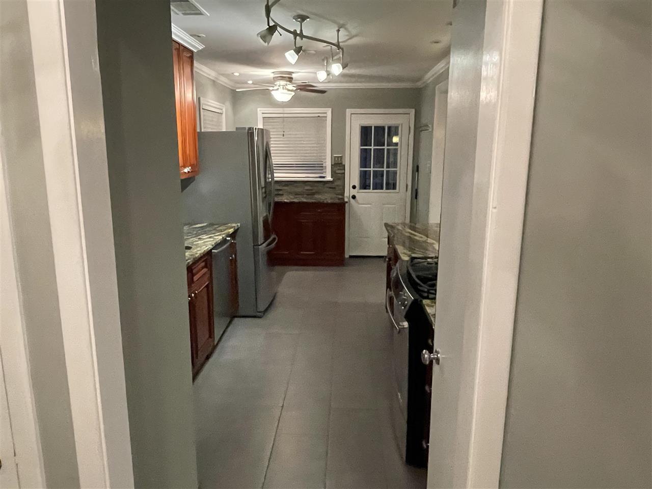 4294 Chickasaw Road Memphis, TN 38117 - Photo 2 of 15 a view of a kitchen from the hallway