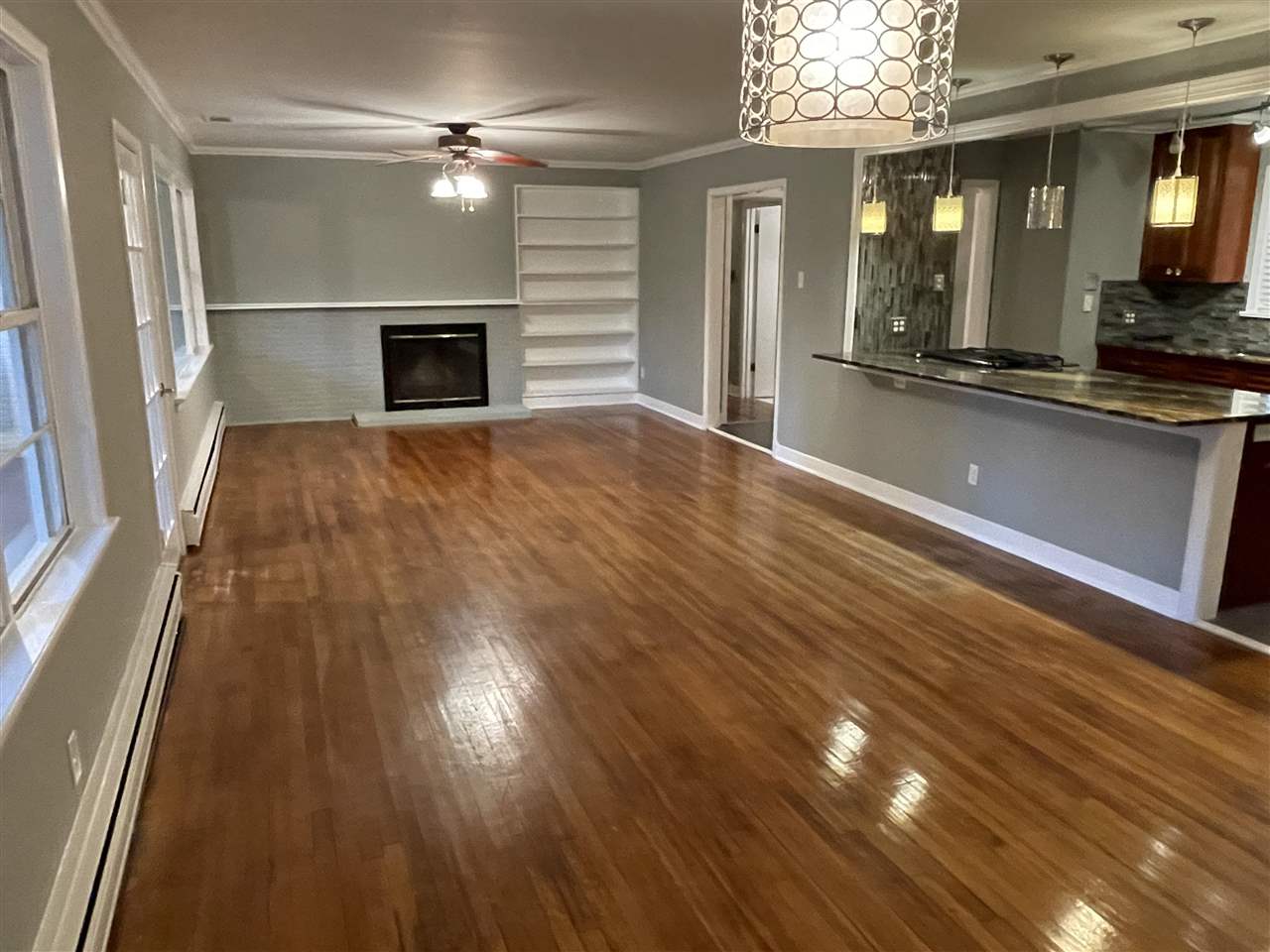 4294 Chickasaw Road Memphis, TN 38117 - Photo 11 of 15 a view of empty room with wooden floor and fan