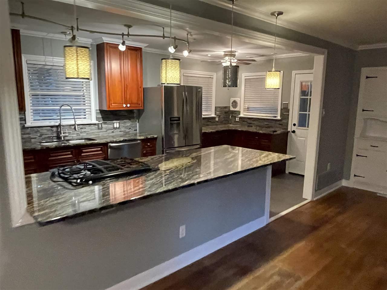 4294 Chickasaw Road Memphis, TN 38117 - Photo 12 of 15 a large kitchen with a large window and stainless steel appliances