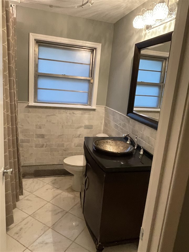 4294 Chickasaw Road Memphis, TN 38117 - Photo 15 of 15 a bathroom with a sink and a toilet