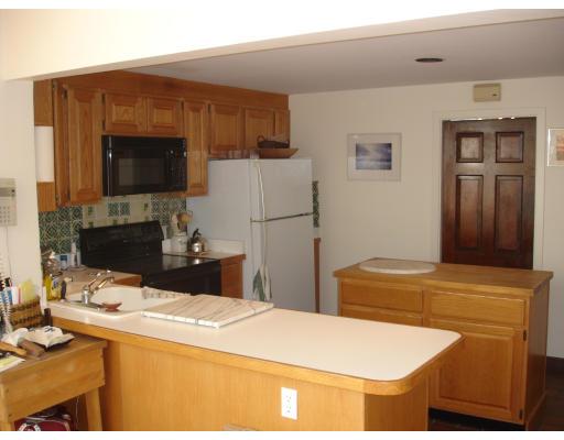 5 Beverly Road Newton, MA 02461 - Photo 5 of 8 a kitchen with stainless steel appliances kitchen island sink refrigerator and stove