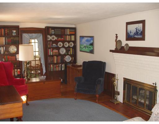 5 Beverly Road Newton, MA 02461 - Photo 8 of 8 a living room with furniture and a fireplace