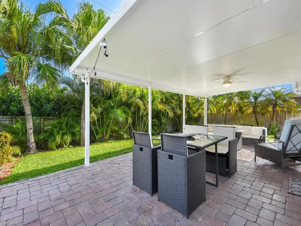 a view of a patio with a backyard