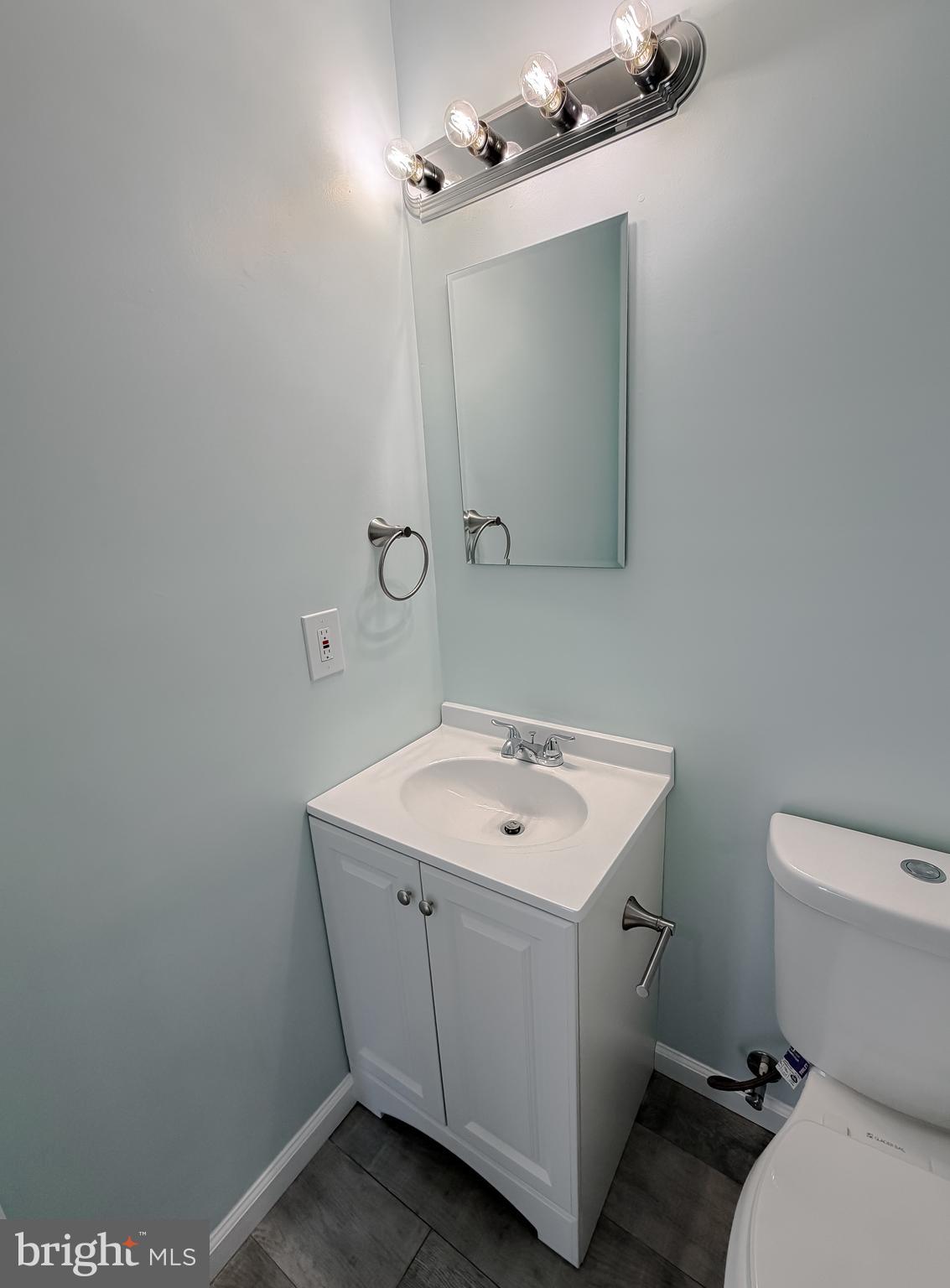 470 Sollers Wharf Road Lusby, MD 20657 - Photo 18 of 43 a view of bathroom with a sink and mirror