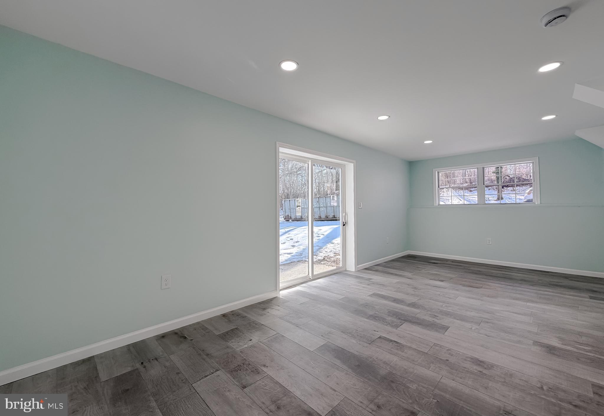 470 Sollers Wharf Road Lusby, MD 20657 - Photo 39 of 43 a view of an empty room with wooden floor and a window