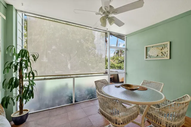 a dining room with a table and chairs