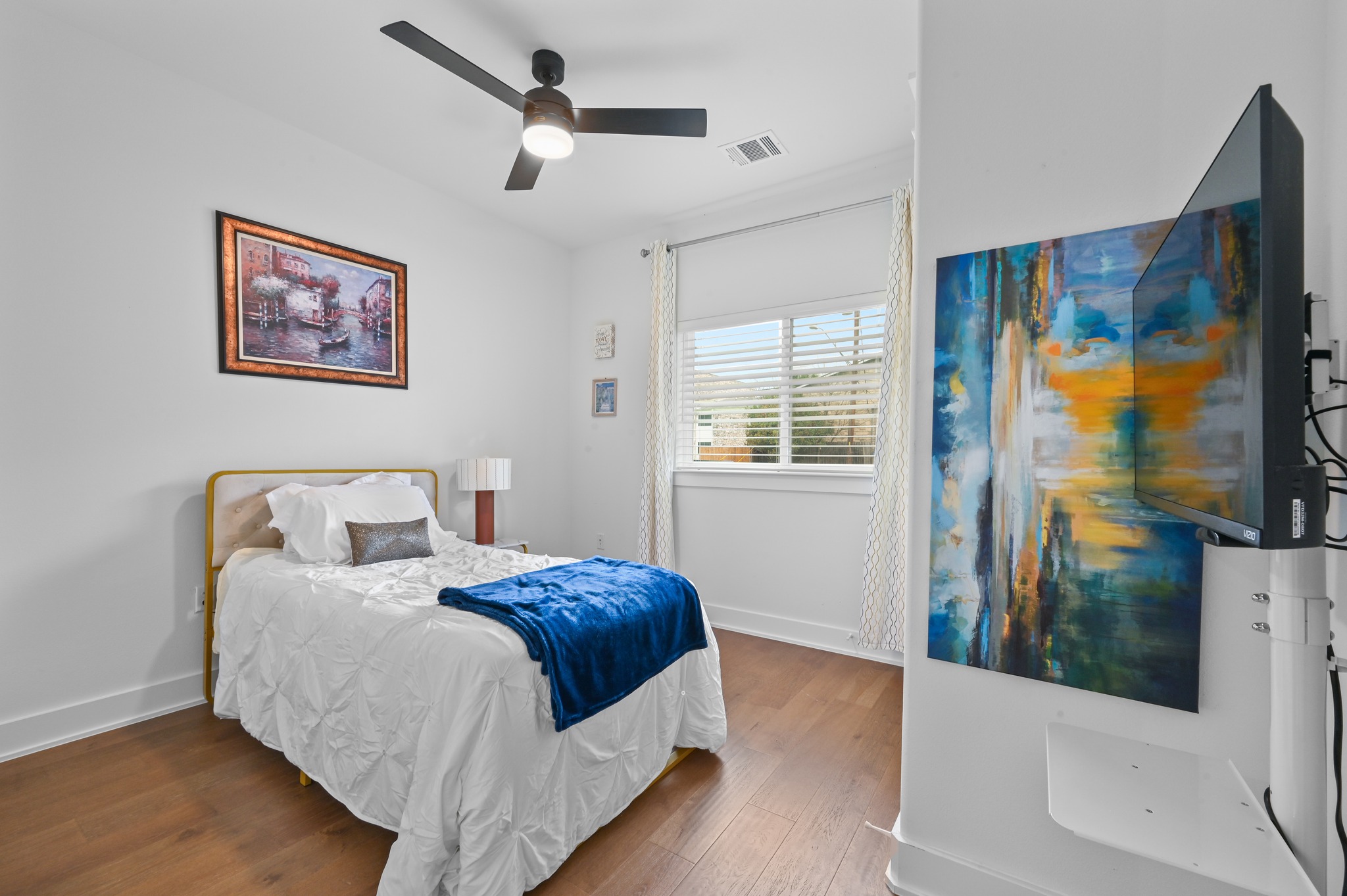 1405 Casey Street, Unit B Austin, TX 78704 - Photo 11 of 28 Bedroom featuring wood finished floors and a ceiling fan