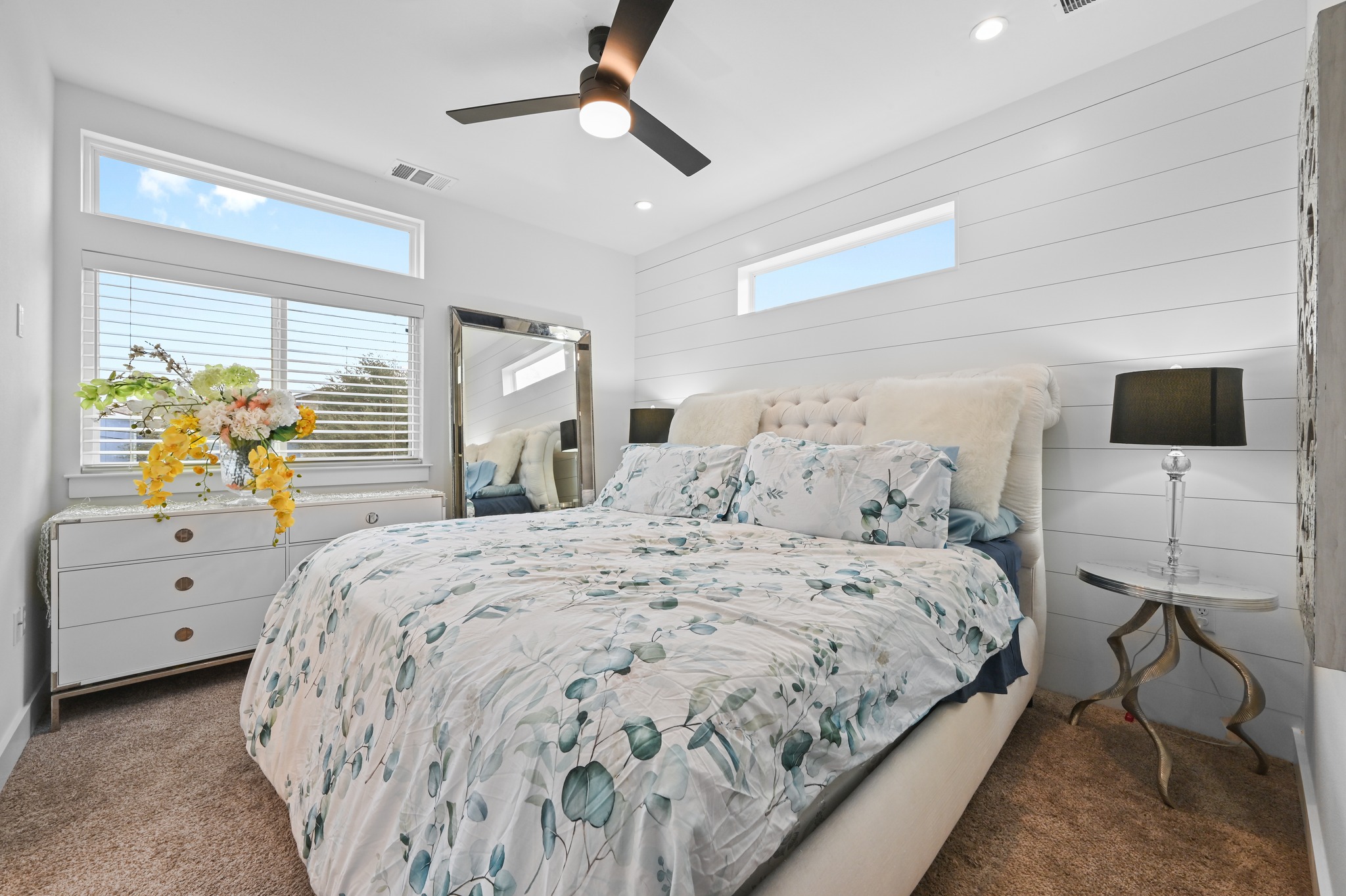 1405 Casey Street, Unit B Austin, TX 78704 - Photo 13 of 28 Bedroom featuring multiple windows, dark carpet, ceiling fan, wood walls, and recessed lighting