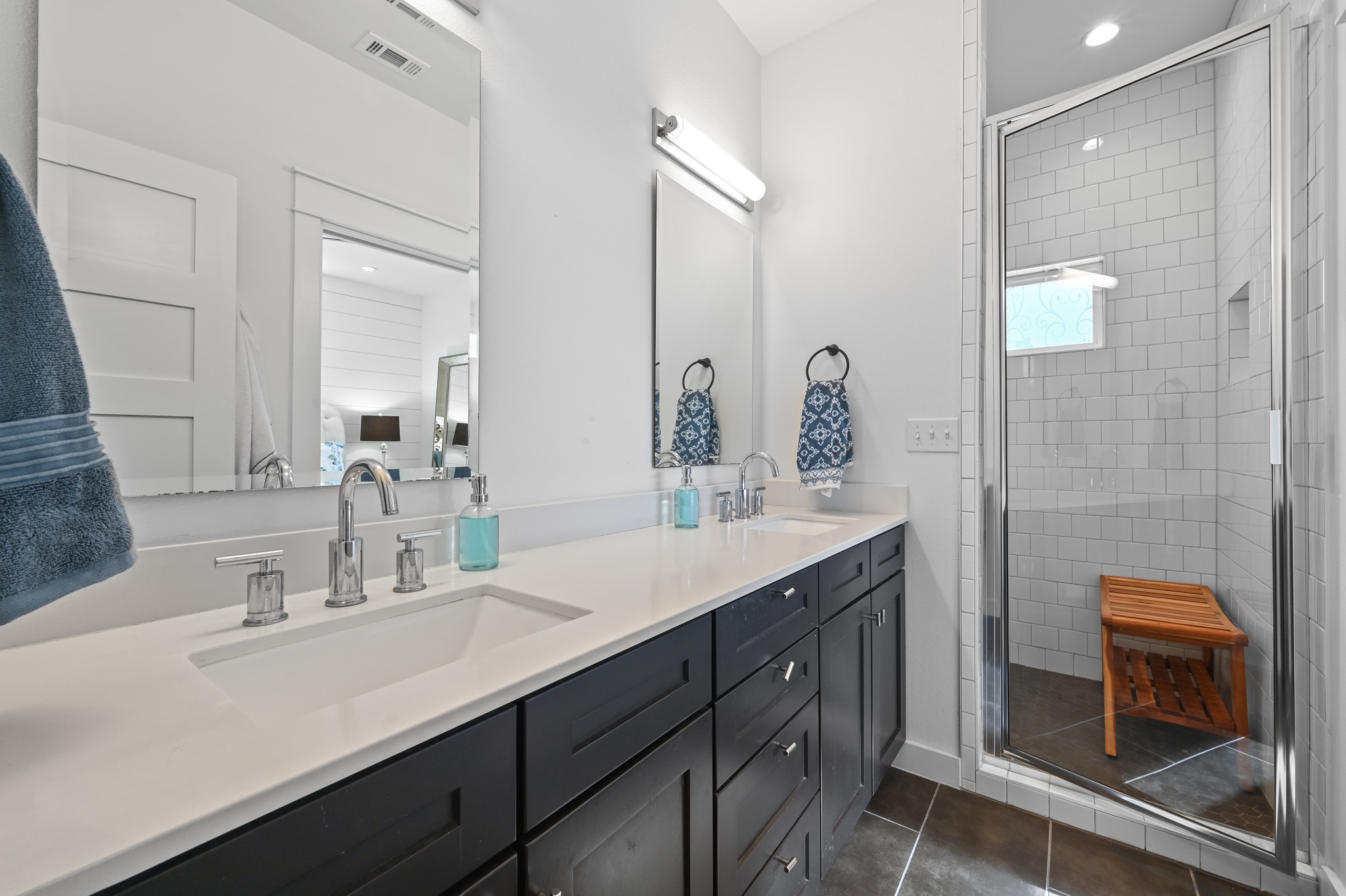 1405 Casey Street, Unit B Austin, TX 78704 - Photo 14 of 28 Full bathroom with double vanity, a stall shower, dark tile patterned flooring, recessed lighting, and connected bathroom