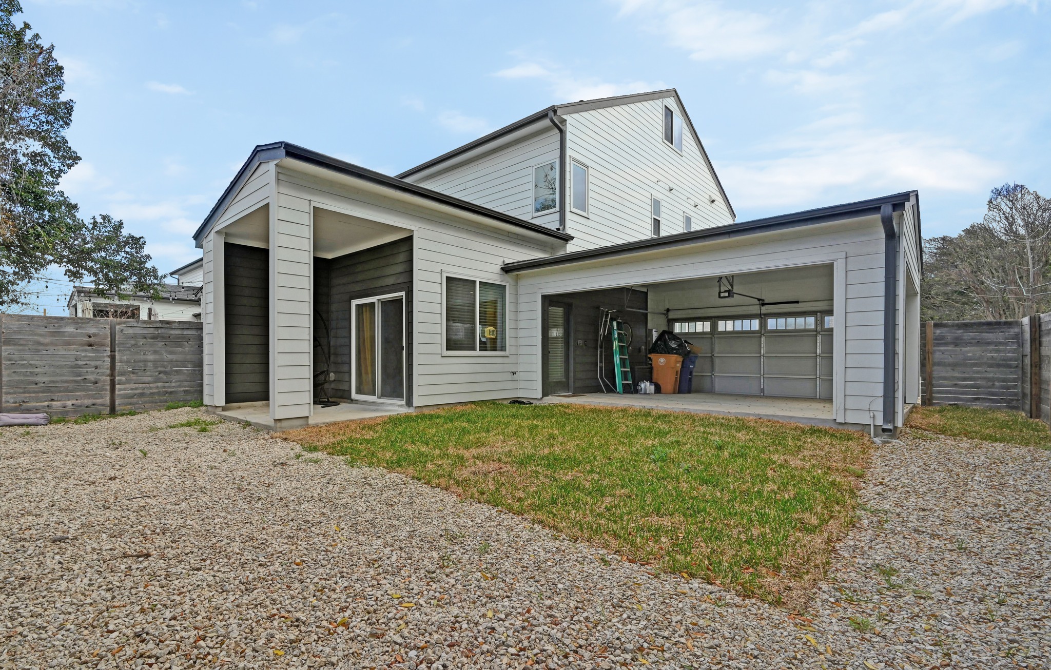 1405 Casey Street, Unit B Austin, TX 78704 - Photo 22 of 28 View of front of house featuring gravel driveway and a patio