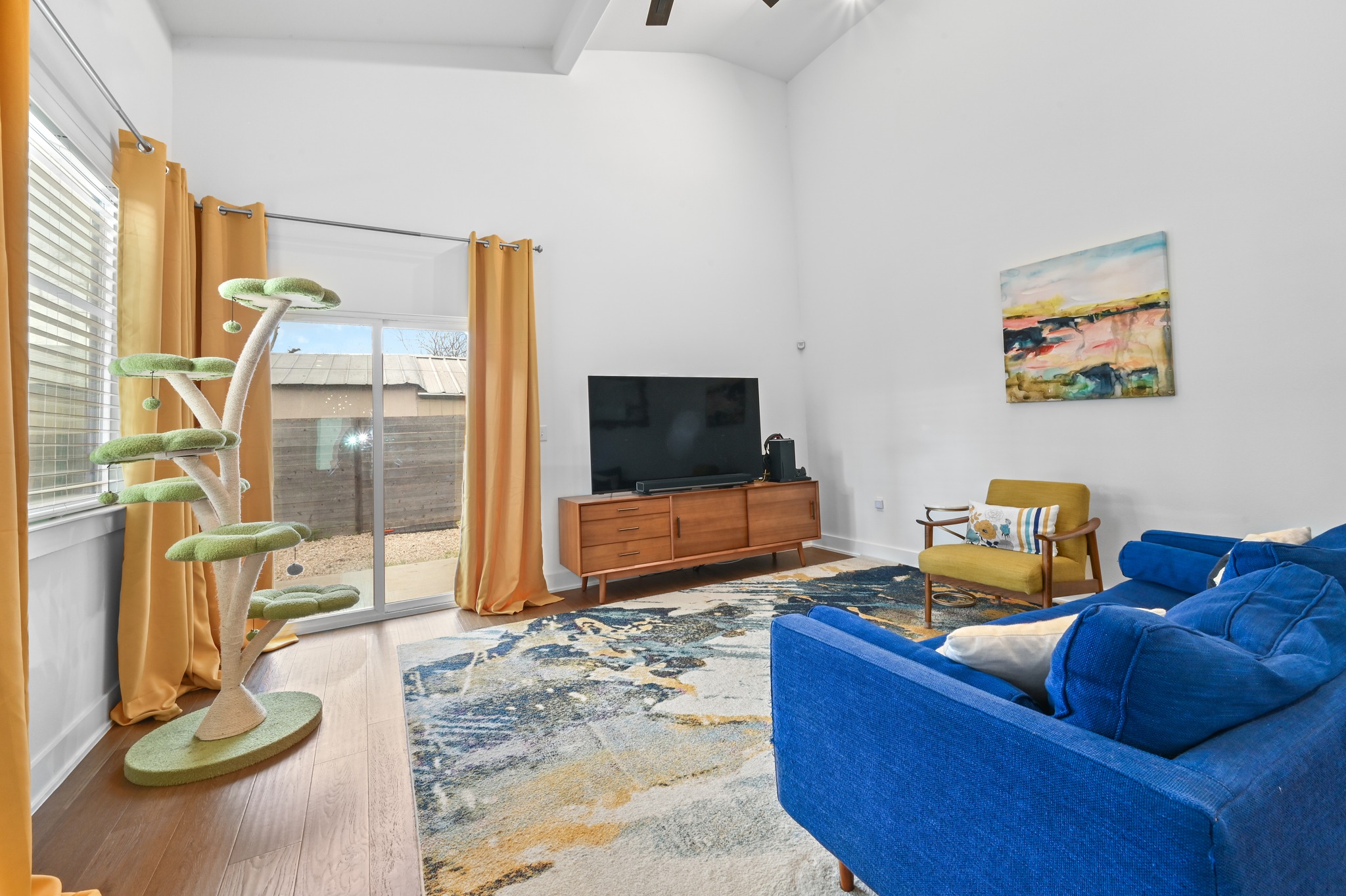 1405 Casey Street, Unit B Austin, TX 78704 - Photo 7 of 28 Living area featuring wood finished floors, a high ceiling, and a ceiling fan