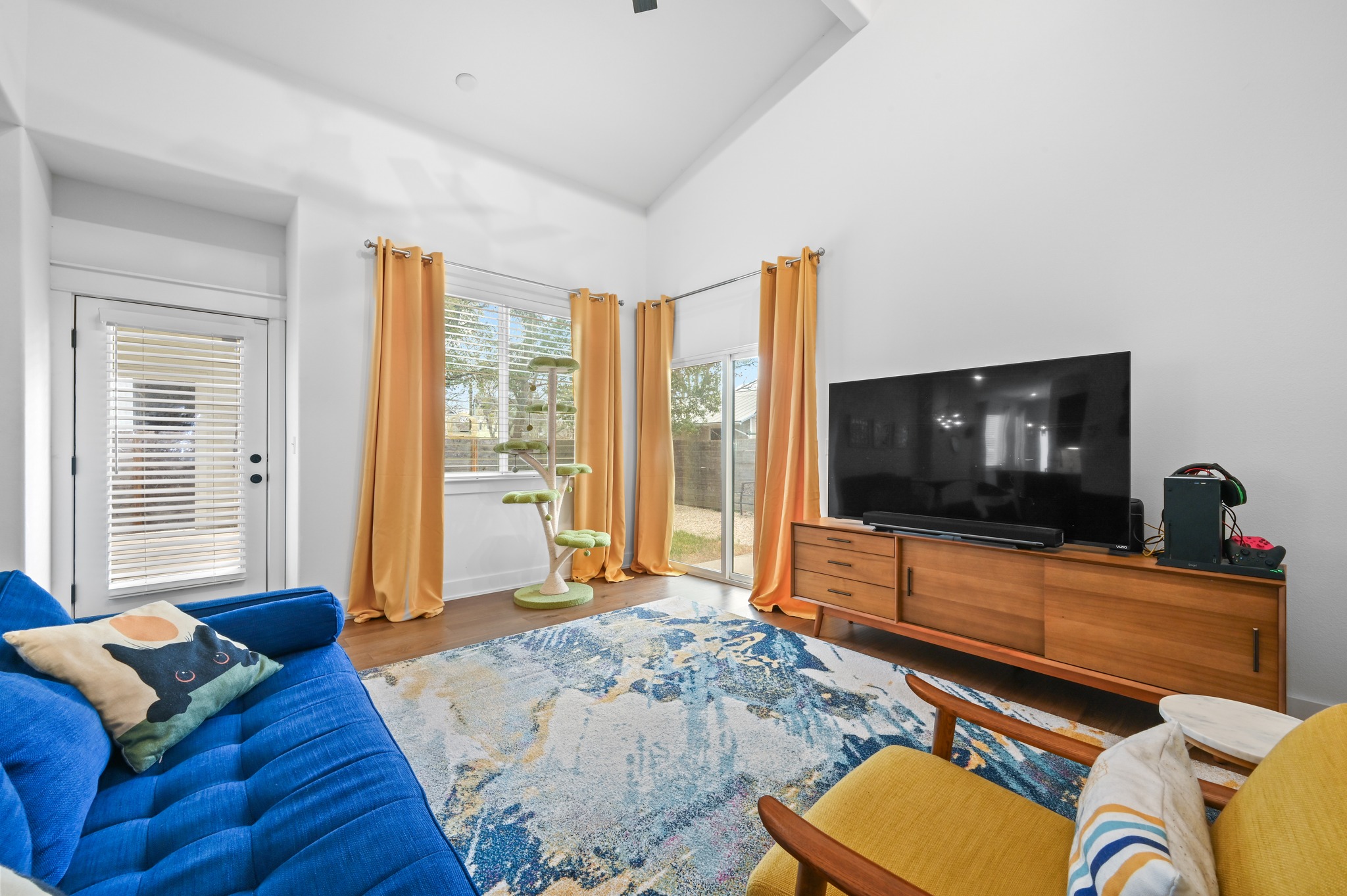 1405 Casey Street, Unit B Austin, TX 78704 - Photo 10 of 28 Living area with lofted ceiling and wood finished floors