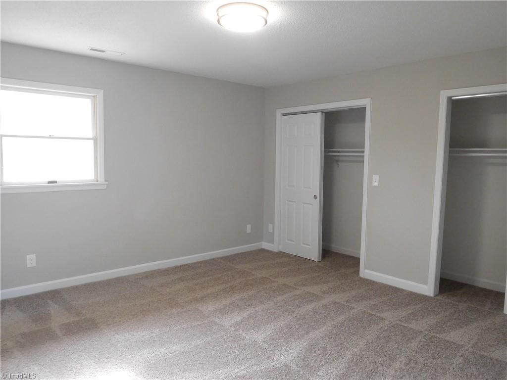 5940 Skylark Road Pfafftown, NC 27040 - Photo 13 of 42 Master Bedroom with double closets and new carpet.