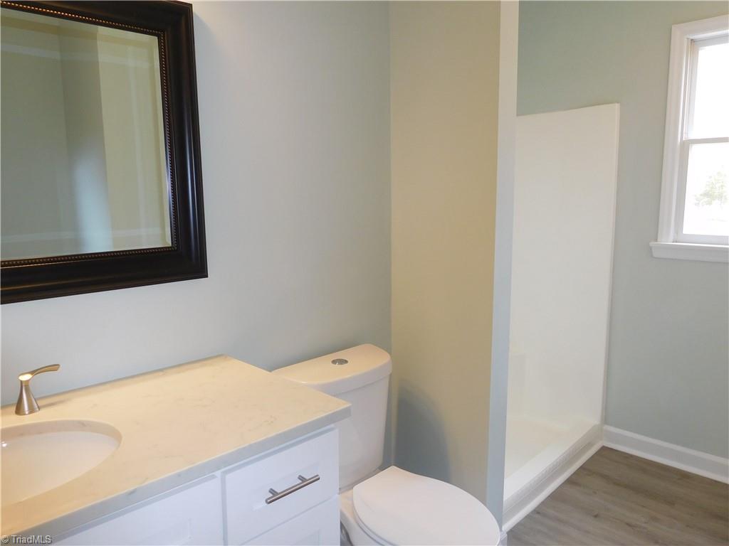 5940 Skylark Road Pfafftown, NC 27040 - Photo 14 of 42 Master Bathroom. Walk-in Shower and linen closet.