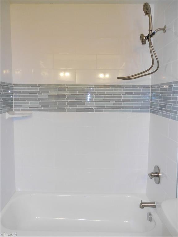 5940 Skylark Road Pfafftown, NC 27040 - Photo 28 of 42 Tiled surround in Basement Bathroom.