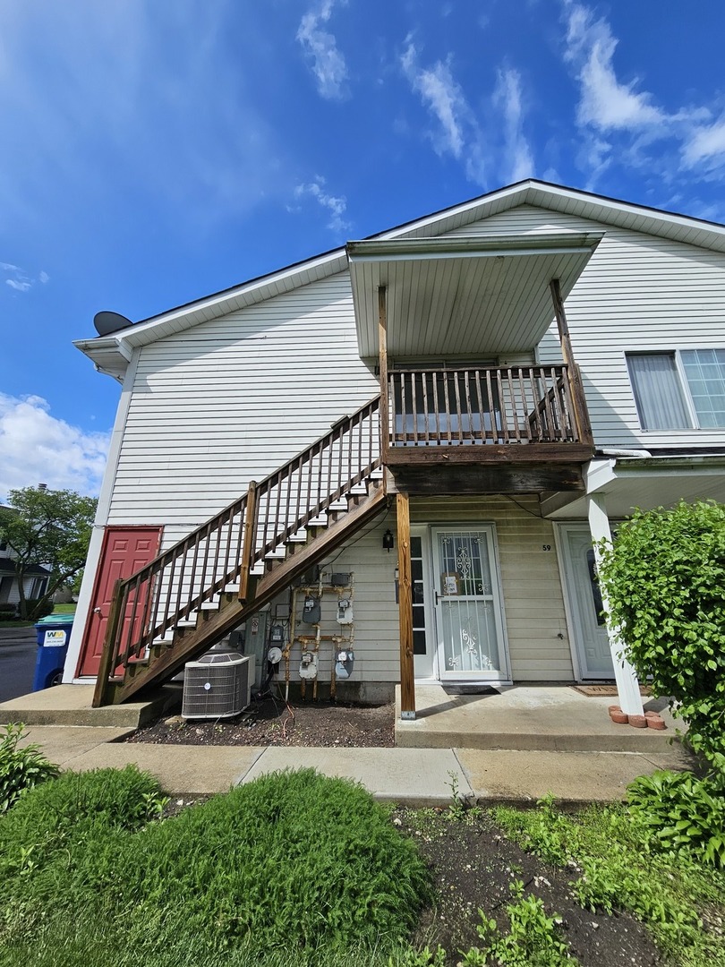 61 Red Barn Road, Unit 1 Matteson, IL 60443 - Photo 11 of 13 a view of a house with a deck