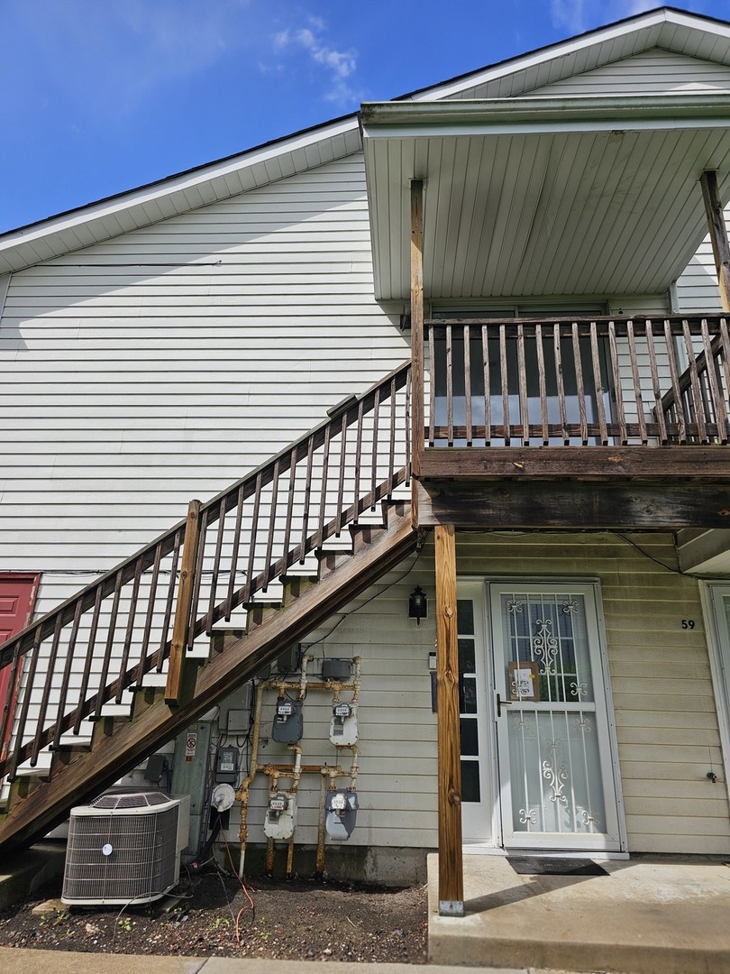 61 Red Barn Road, Unit 1 Matteson, IL 60443 - Photo 10 of 13 a view of a house with a balcony