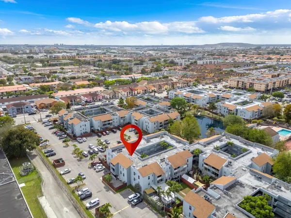 an aerial view of residential building with city view