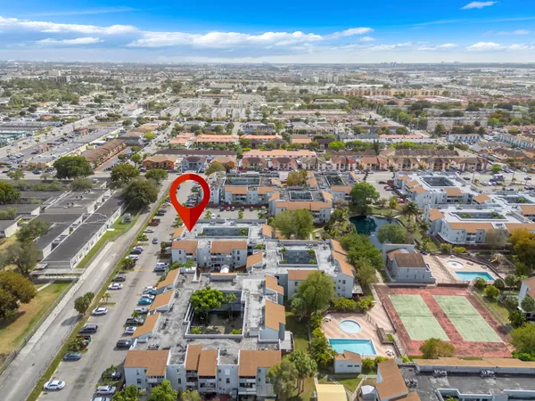 an aerial view of residential houses with outdoor space
