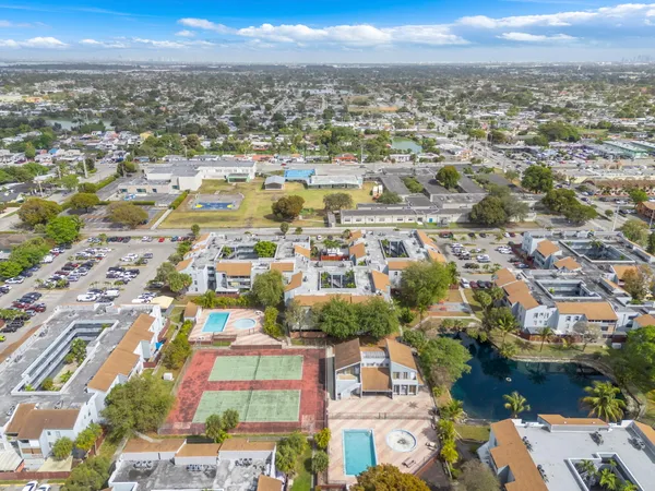 an aerial view of residential building with parking space