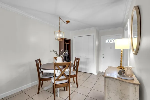 a dining room with furniture and a chandelier