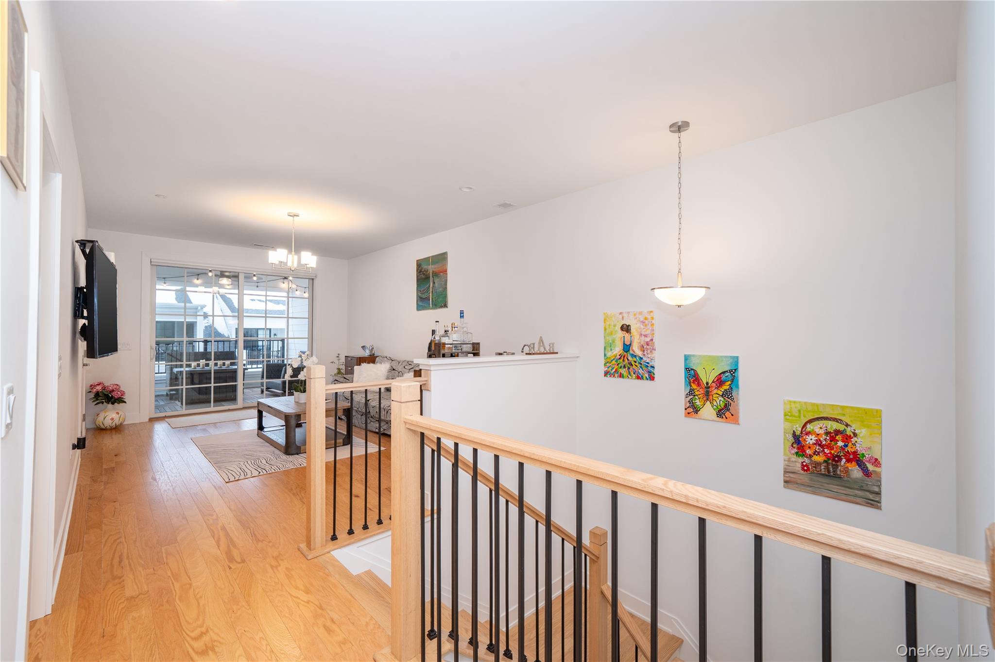 4 Wright Drive Chappaqua, NY 10514 - Photo 13 of 35 Upstairs includes 3 bedrooms, a home office, and a second family room with large sliding glass doors to a large private terrace.