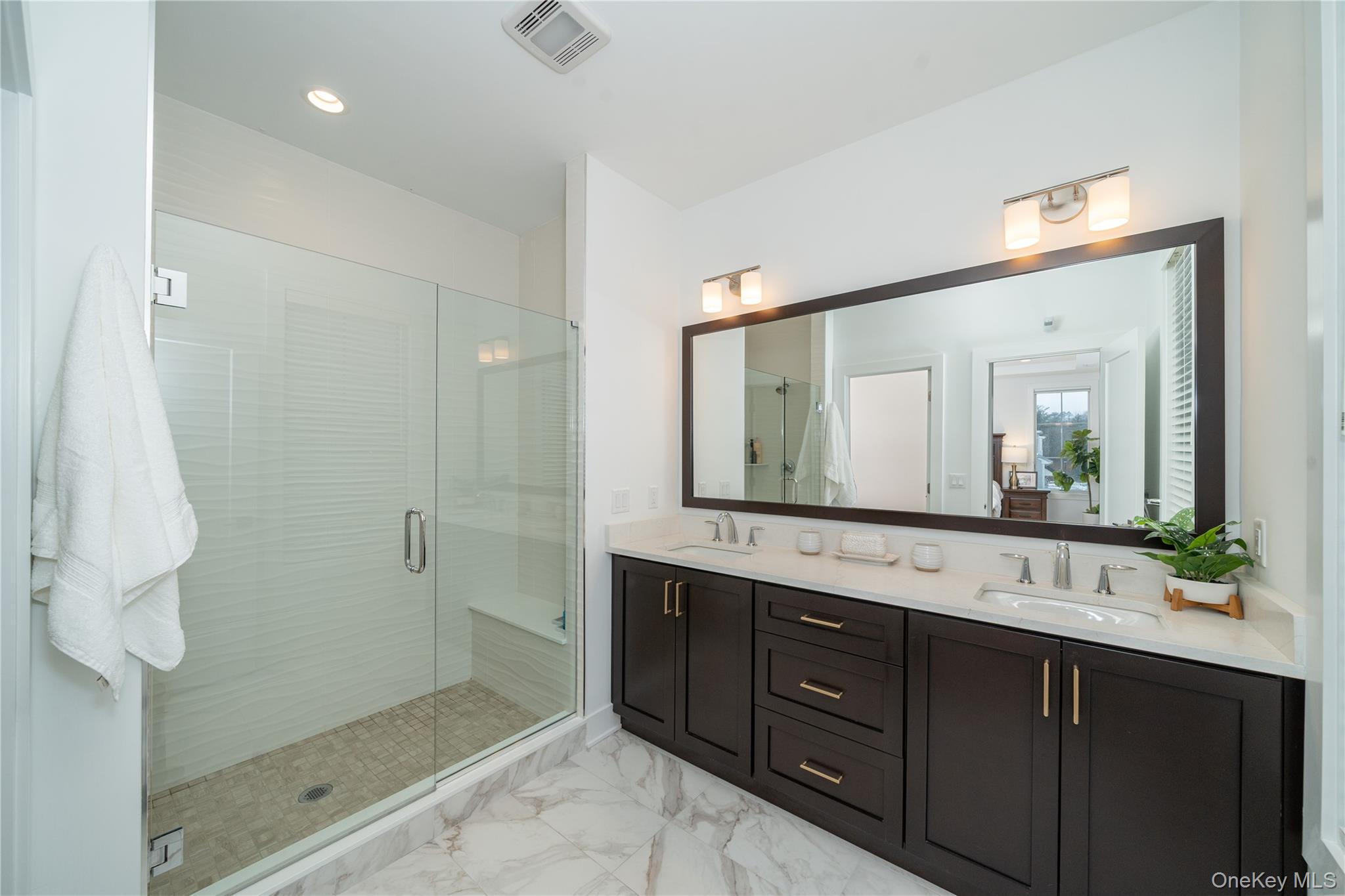 4 Wright Drive Chappaqua, NY 10514 - Photo 20 of 35 Spa-inspired bath with a double-sink vanity, oversized shower, and a private toilet room for added comfort.