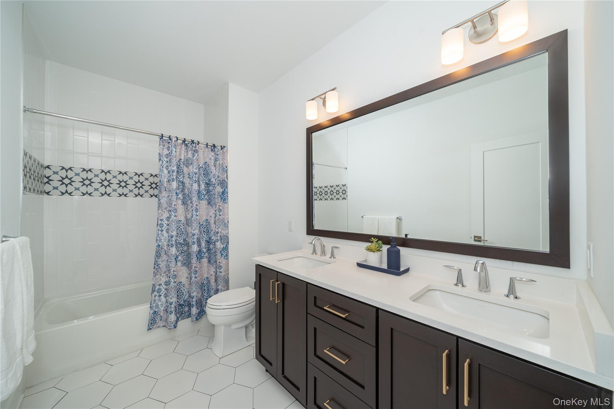 4 Wright Drive Chappaqua, NY 10514 - Photo 23 of 35 Well-appointed hall bath with quartz double sinks and modern finishes.