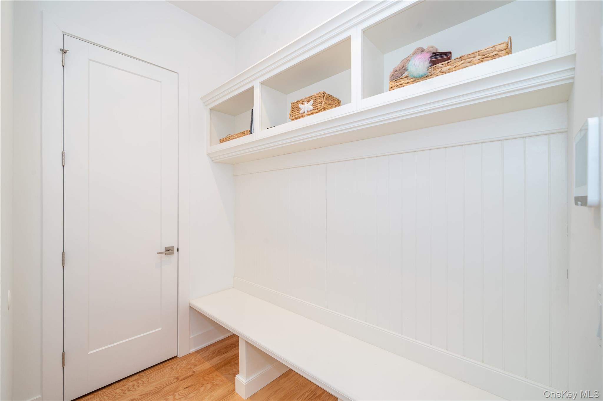 4 Wright Drive Chappaqua, NY 10514 - Photo 25 of 35 Enter from the 2 car garage to the custom mudroom with built-in cubbies, bench seating and closet, thoughtfully designed for organization and everyday convenience.