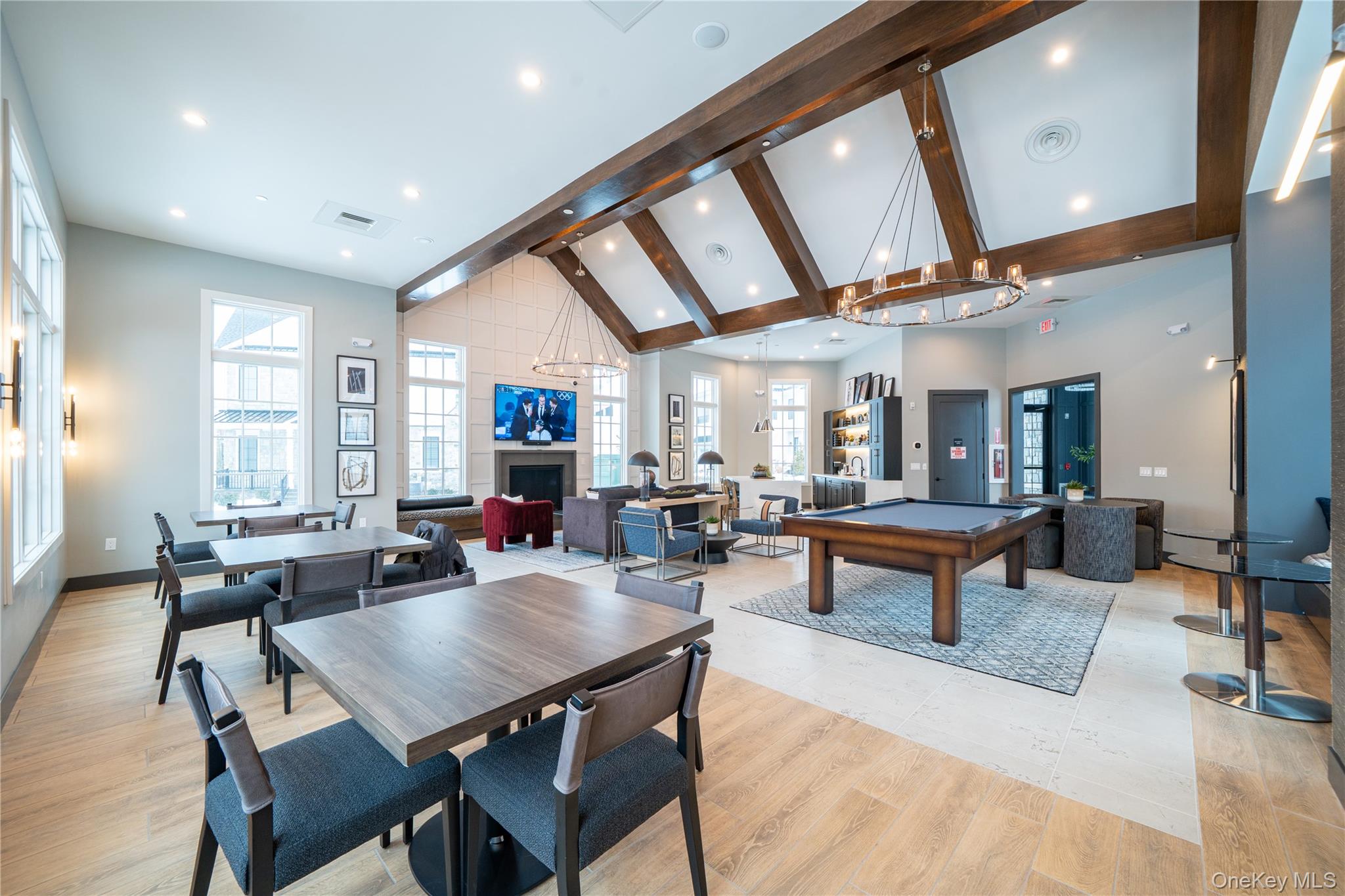 4 Wright Drive Chappaqua, NY 10514 - Photo 29 of 35 Large recreation room with fireplace, tv, billiard table, game tables and open kitchen.