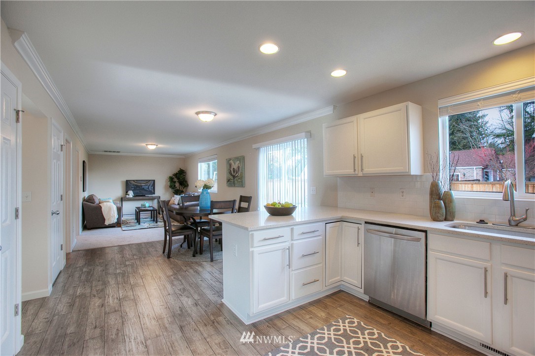 515 Harrison Street Sumner, WA 98390 - Photo 14 of 25 a kitchen with a sink and cabinets