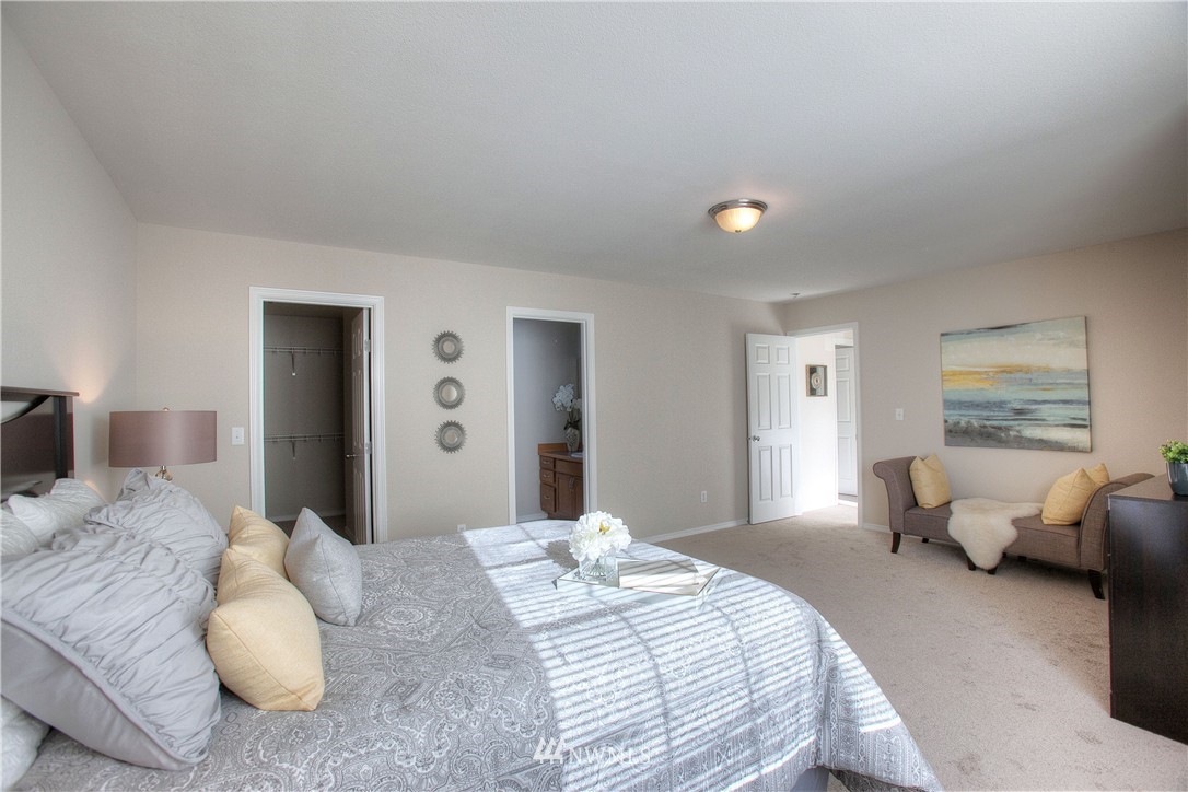515 Harrison Street Sumner, WA 98390 - Photo 24 of 25 a bedroom with a bed and couch