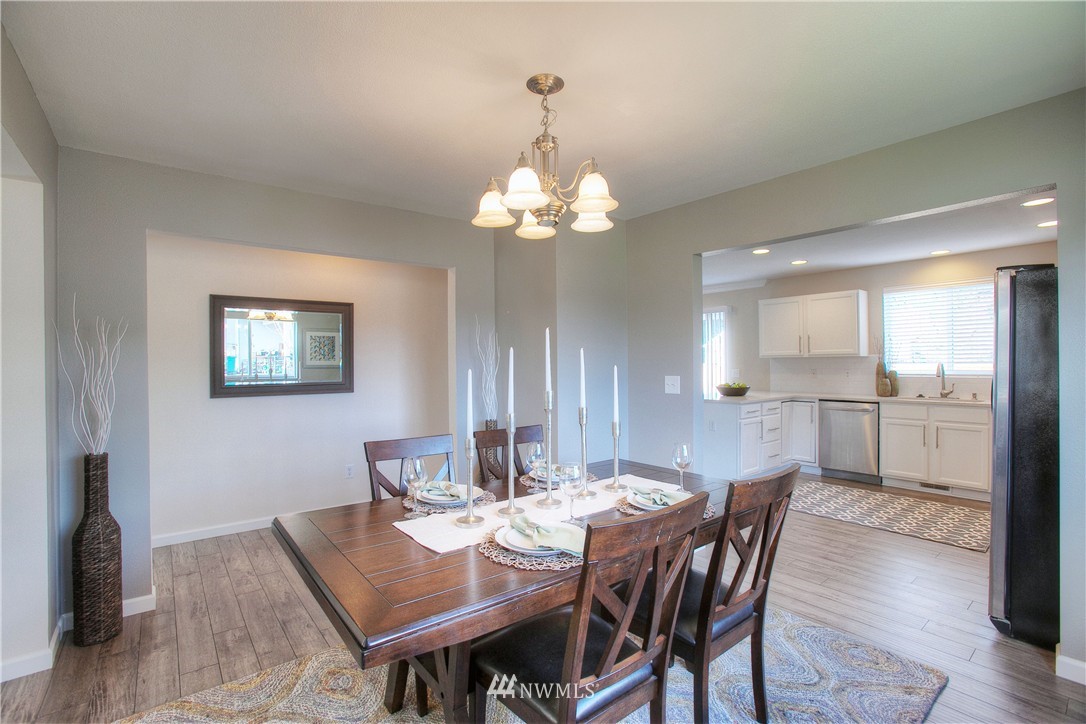 515 Harrison Street Sumner, WA 98390 - Photo 6 of 25 a view of a dining room with furniture and wooden floor
