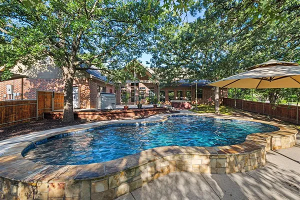 swimming pool view with a seating space