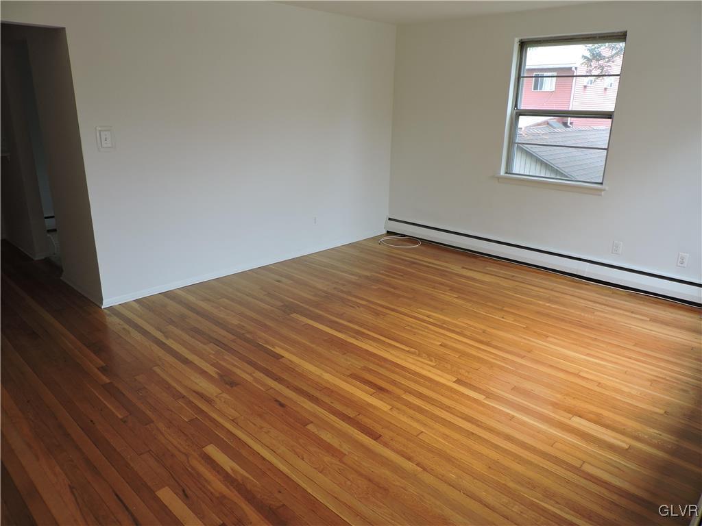434 North Leh Street, Unit 1B Allentown, PA 18104 - Photo 5 of 7 a view of empty room with wooden floor and fan
