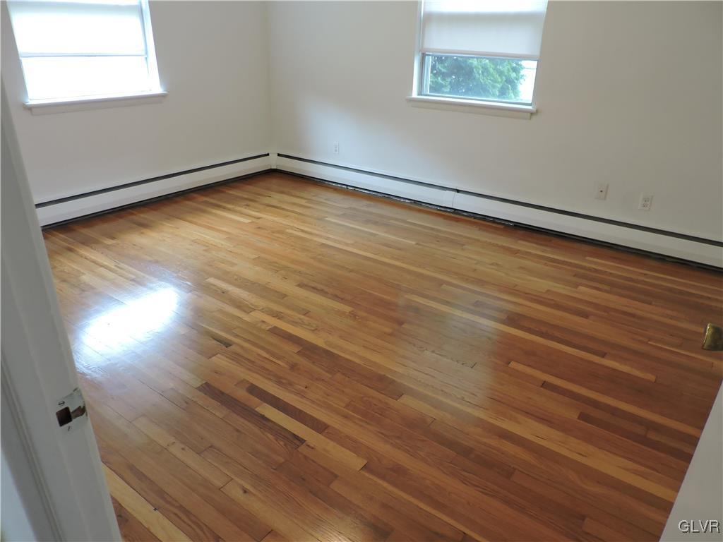 434 North Leh Street, Unit 1B Allentown, PA 18104 - Photo 6 of 7 an empty room with wooden floor and windows