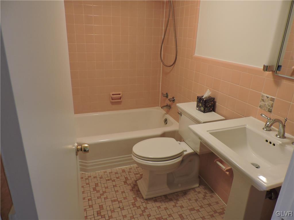434 North Leh Street, Unit 1B Allentown, PA 18104 - Photo 7 of 7 a bathroom with a sink toilet and shower
