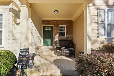 a backyard of a house with outdoor seating