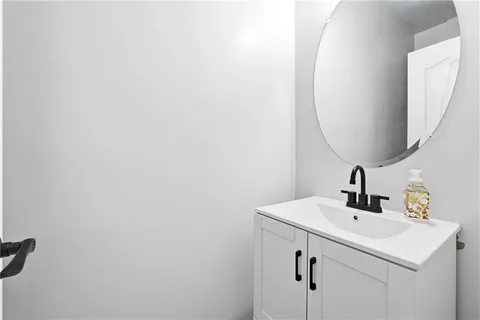 a bathroom with a sink and mirror