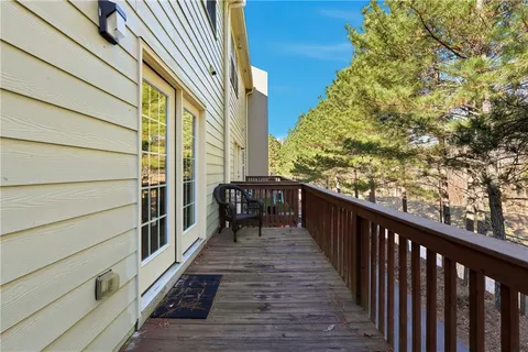 a balcony with view of wooden floor